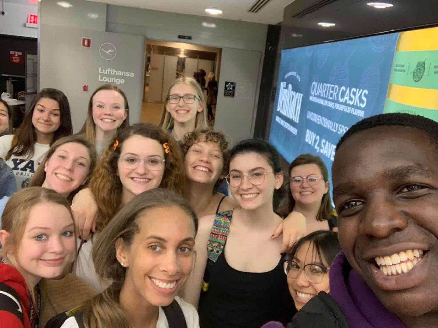 A Student Study Tour group takes a selfie in the Lufthansa Lounge at John F. Kennedy Airport.